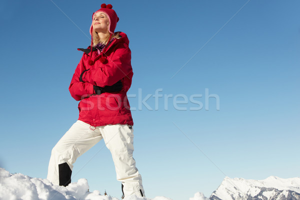 Woman Standing In Snow Wearing Warm Clothes On Ski Holiday In Mo Stock photo © monkey_business