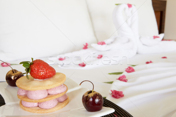 Dessert On Plate Next To Decorated Hotel Bed Stock photo © monkey_business