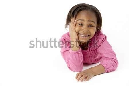 Stock photo: Young Girl Lying On Stomach In Studio