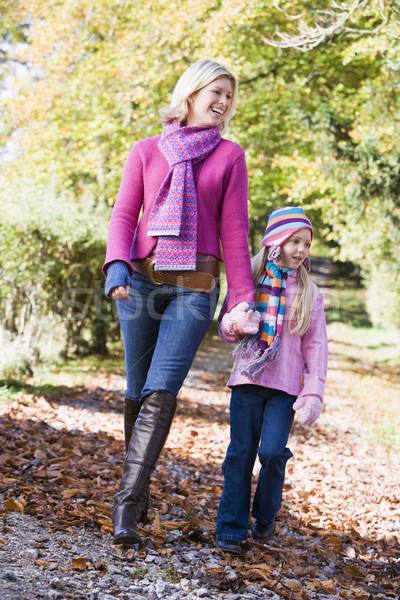 Mother and daughter walking along woodland path Stock photo © monkey_business