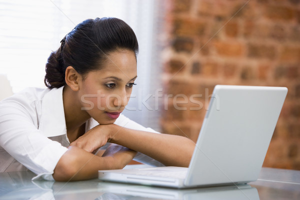 Businesswoman in office with laptop Stock photo © monkey_business