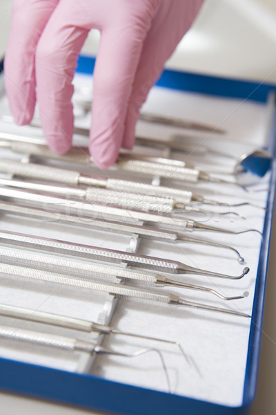 Dental tools with a gloved hand Stock photo © monkey_business