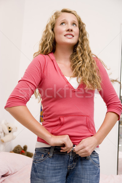 Teenage Girl Trying To Zip Up Her Denim Jeans  Stock photo © monkey_business