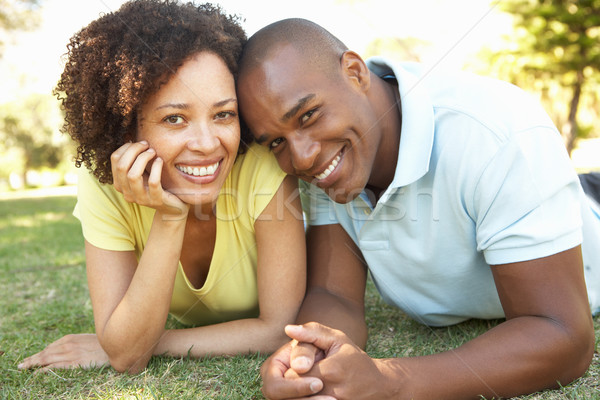 Portrait Of Young Couple Laying On Grass In Park Stock photo © monkey_business