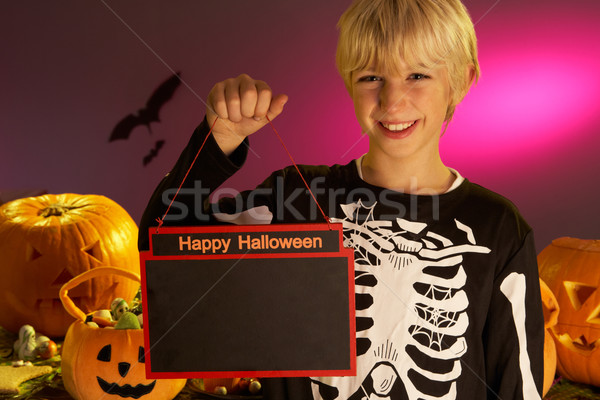 Halloween party with a boy child holding sign Stock photo © monkey_business