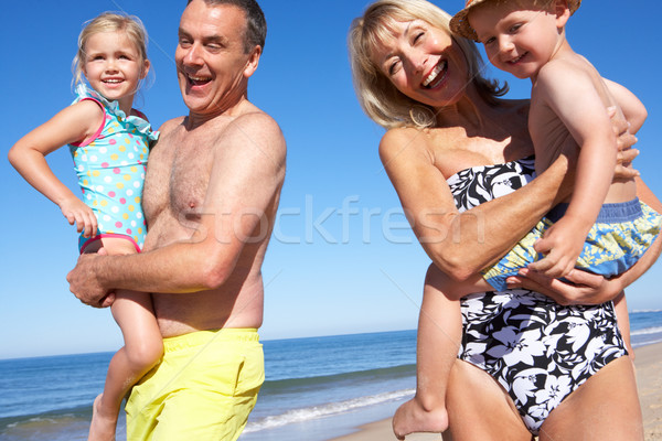 Stockfoto: Grootouders · kleinkinderen · genieten · strandvakantie · strand · man