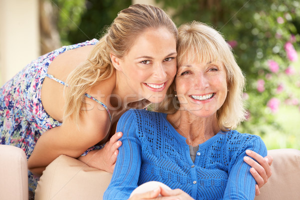 Senior Woman With Adult Daughter Relaxing On Sofa At Home Stock photo © monkey_business