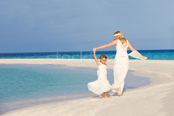 Bride With Bridesmaid At Beautiful Beach Wedding Stock photo © monkey_business