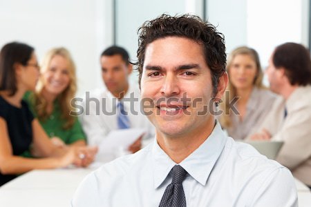Portrait Of Businessman Sitting At Boardroom Table Stock photo © monkey_business