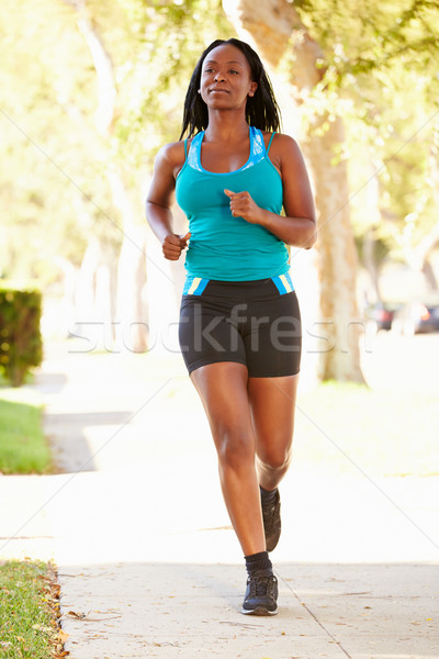 Femminile runner suburbana strada donne Foto d'archivio © monkey_business