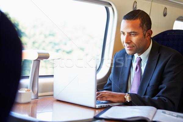 Geschäftsmann Pendeln Arbeit Zug mit Laptop Mann Stock foto © monkey_business