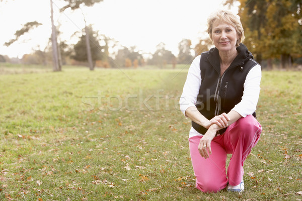 Portrait Of Senior Woman Crouching In The Park Stock photo © monkey_business