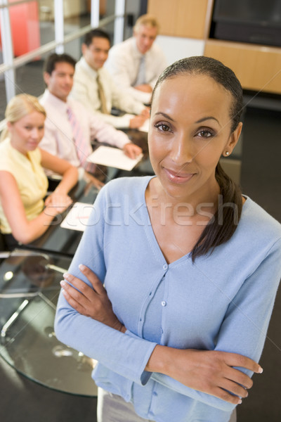 Mujer de negocios cuatro sala de juntas mesa negocios Foto stock © monkey_business