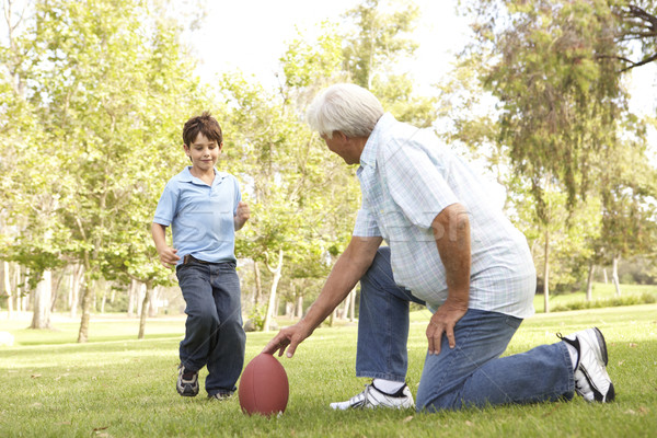 Grand-père petit-fils jouer football ensemble [[stock_photo]] © monkey_business