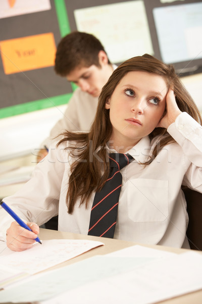 Foto d'archivio: Annoiato · femminile · adolescente · studente · studiare · classe