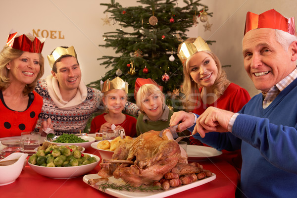 Three Generation Family Enjoying Christmas Meal At Home Stock photo © monkey_business