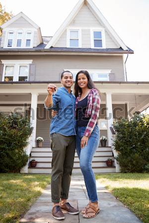 Hispanic couple outside new home Stock photo © monkey_business