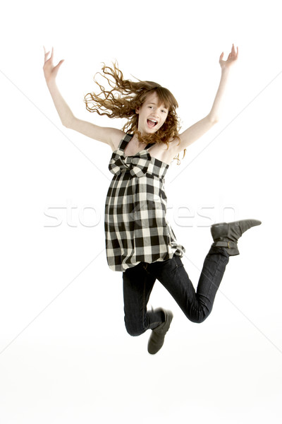 Jeune fille sautant air enfants enfant couleur Photo stock © monkey_business