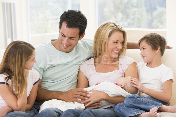 Family in living room with baby smiling Stock photo © monkey_business