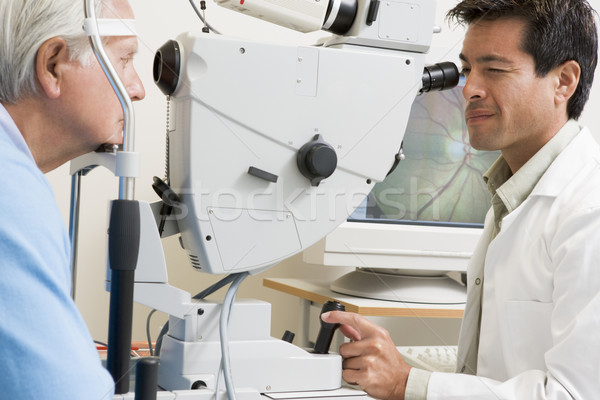 Doctor Checking Patient's Eyes Stock photo © monkey_business