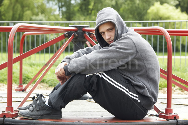 Młody człowiek posiedzenia boisko człowiek ulicy smutne Zdjęcia stock © monkey_business