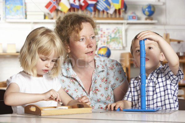 Adult Helping Two Young Children at Montessori/Pre-School Stock photo © monkey_business