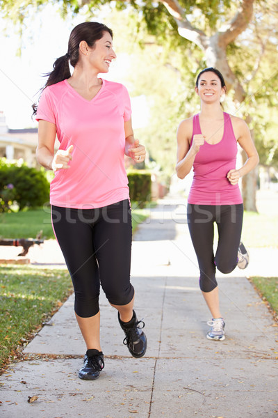 Two Female Runners Exercising On Suburban Street Stock photo © monkey_business