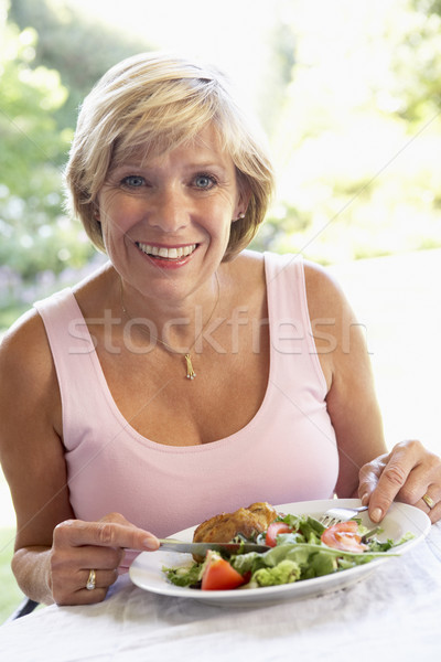 Middle Aged Woman Eating An Al Fresco Lunch Stock photo © monkey_business