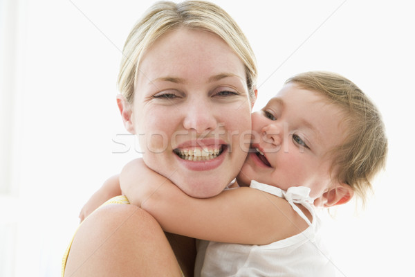 Mother and baby indoors hugging and smiling Stock photo © monkey_business