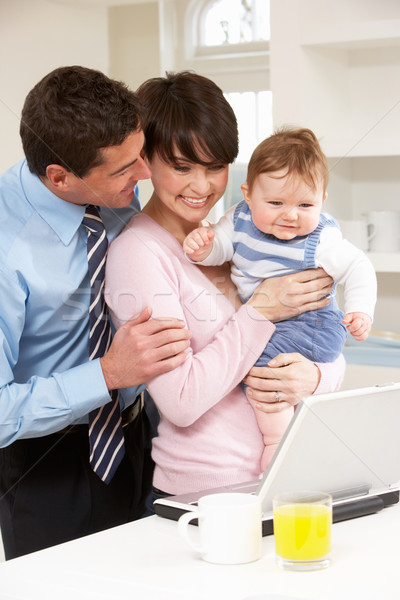 [[stock_photo]]: Parents · bébé · travail · maison · utilisant · un · ordinateur · portable · ordinateur