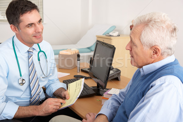 British GP talking to senior man in surgery Stock photo © monkey_business
