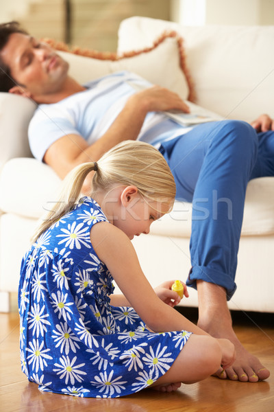 Daughter Painting Sleeping Father's Toenails At Home Stock photo © monkey_business