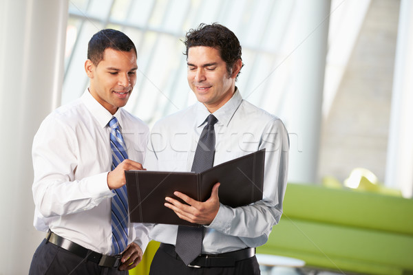Dos empresarios informal reunión moderna oficina Foto stock © monkey_business