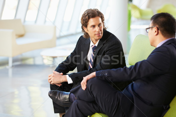 Two Businessmen Sitting On Sofa In Modern Office Stock photo © monkey_business