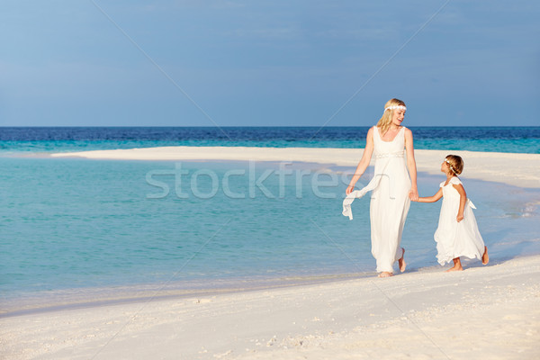 Bride With Bridesmaid At Beautiful Beach Wedding Stock photo © monkey_business