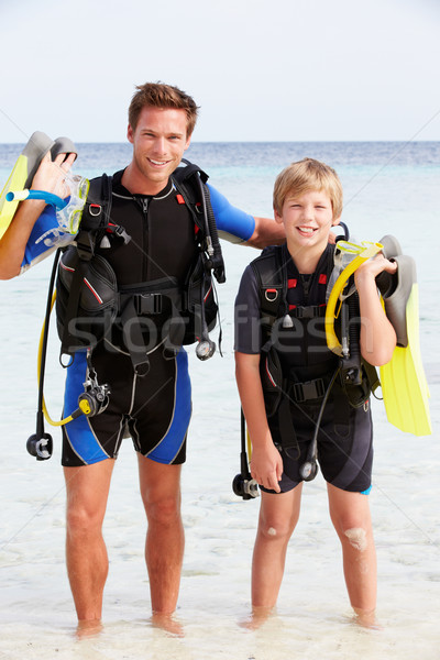 Father And Son With Scuba Diving Equipment On Beach Holiday Stock photo © monkey_business