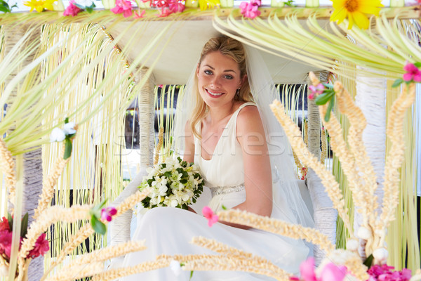 Bride Sitting Under Decorated Canopy At Wedding Stock photo © monkey_business