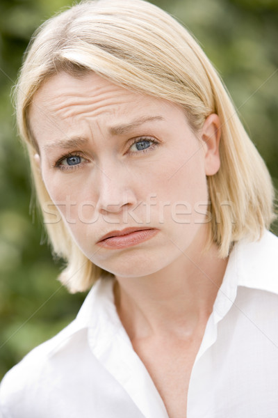 Stock photo: Head shot of sad woman