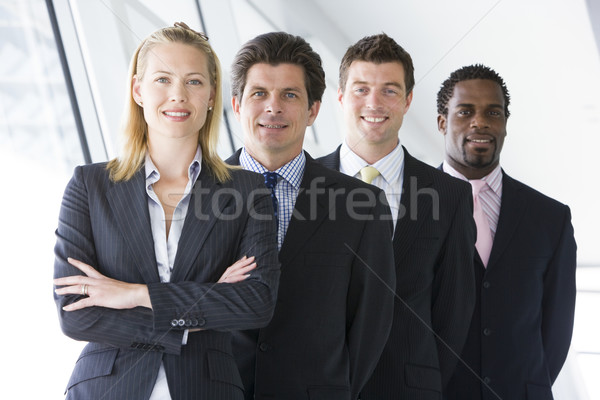 [[stock_photo]]: Quatre · gens · d'affaires · permanent · couloir · souriant · bureau