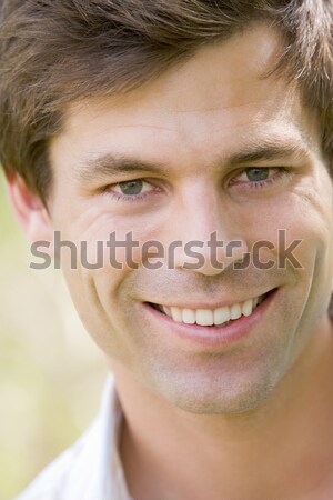 человека играет волос улыбаясь портрет мужчины Сток-фото © monkey_business