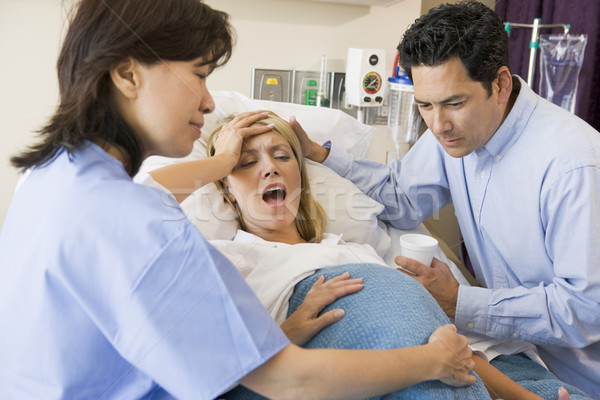 Kobieta urodzenia kobiet medycznych para ciąży Zdjęcia stock © monkey_business