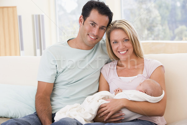 Couple in living room with baby smiling Stock photo © monkey_business