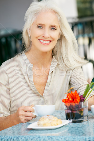 Senior Woman Enjoying Snack At Outdoor Caf Stock photo © monkey_business