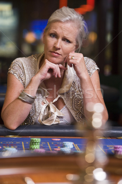 Woman losing at roulette table  Stock photo © monkey_business