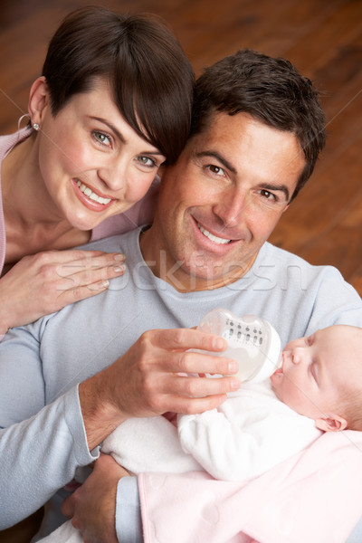 Portrait Of Parents Feeding Newborn Baby At Home Stock photo © monkey_business