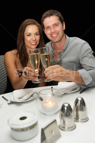 Young couple in restaurant Stock photo © monkey_business