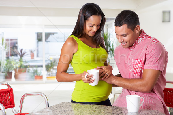 Pregnant Woman And Husband Having Breakfast In Kitchen Stock photo © monkey_business
