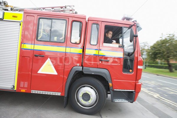 Carro de bombeiros fogo estação homem cor condução Foto stock © monkey_business
