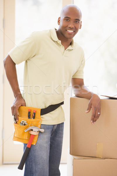Uomo indossare strumento cintura piedi scatole Foto d'archivio © monkey_business