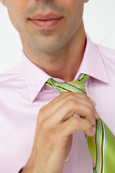 Buisnessman putting on tie Stock photo © monkey_business